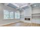 Bright living room with built-in shelving, fireplace, and coffered ceiling detail at 1037 Oakmont Dr, Rock Hill, SC 29732