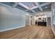 Open-concept living space with coffered ceilings, flowing into a stylish kitchen at 1037 Oakmont Dr, Rock Hill, SC 29732