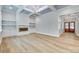 Bright living room featuring a fireplace, built-in shelves, and coffered ceilings with a modern chandelier at 1037 Oakmont Dr, Rock Hill, SC 29732