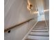 Well-lit stairwell featuring decorative wall sconces and hardwood stairs at 1037 Oakmont Dr, Rock Hill, SC 29732