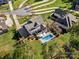 Aerial view showcasing a home's backyard pool and landscaping at 116 Cedar Branch Ct, Mooresville, NC 28117