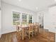 Bright dining area with hardwood floors and a view of the backyard at 116 Cedar Branch Ct, Mooresville, NC 28117