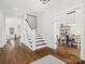 Hardwood floors and staircase in bright entryway at 116 Cedar Branch Ct, Mooresville, NC 28117