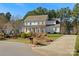 Two-story home with white siding, gray door, and a long driveway at 116 Cedar Branch Ct, Mooresville, NC 28117