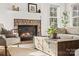 Brick fireplace with rustic style mantel in living room at 116 Cedar Branch Ct, Mooresville, NC 28117