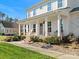 Two-story home with a front porch featuring rocking chairs at 116 Cedar Branch Ct, Mooresville, NC 28117