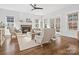 Living room with fireplace, hardwood floors and access to back patio at 116 Cedar Branch Ct, Mooresville, NC 28117