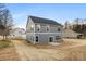 Exterior rear shot shows home's gray siding, yard, windows, and sliding doors at 1305 39Th Avenue Ne Pl, Hickory, NC 28601