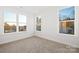 Bright bedroom featuring neutral carpet, multiple windows, and light walls at 1305 39Th Avenue Ne Pl, Hickory, NC 28601