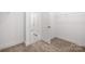 Neutral closet with beige carpet, wire shelving, and doors at 1305 39Th Avenue Ne Pl, Hickory, NC 28601