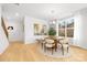 Bright dining room with a round table, comfortable chairs, and a staircase in a modern home at 1305 39Th Avenue Ne Pl, Hickory, NC 28601