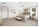 Inviting main bedroom featuring a large bed, multiple windows, and neutral color palette at 1305 39Th Avenue Ne Pl, Hickory, NC 28601