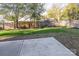 Landscaped backyard with a concrete patio and wooden fence at 1305 39Th Avenue Nw Pl, Hickory, NC 28601