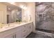 Modern bathroom boasts double sinks, quartz countertops and a marble shower at 1305 39Th Avenue Nw Pl, Hickory, NC 28601