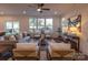 Living room with gray sofa and two armchairs, coffee table, and hardwood floors at 1305 39Th Avenue Nw Pl, Hickory, NC 28601