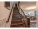 Modern staircase with dark wood treads and metal railing at 1305 39Th Avenue Nw Pl, Hickory, NC 28601