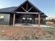 Covered patio with ceiling fan, seating area, and view of the backyard at 187 Lone Pine Rd, Statesville, NC 28625