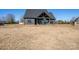 Large backyard with view of the home's back patio and surrounding landscape at 187 Lone Pine Rd, Statesville, NC 28625