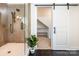 Bathroom with walk in shower and barn door leading to storage at 187 Lone Pine Rd, Statesville, NC 28625