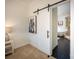 Bedroom with barn door entry to bathroom at 187 Lone Pine Rd, Statesville, NC 28625