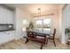 Farmhouse style dining area with wooden table and bench, overlooking the backyard at 187 Lone Pine Rd, Statesville, NC 28625