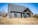 Rear view of home with covered patio and sliding glass doors at 187 Lone Pine Rd, Statesville, NC 28625