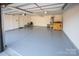 Spacious garage with clean epoxy flooring offers ample space for parking and storage solutions at 187 Lone Pine Rd, Statesville, NC 28625