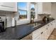 Kitchen boasts modern sink, dishwasher, and ample counter space with window view at 187 Lone Pine Rd, Statesville, NC 28625