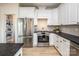 Modern kitchen with stainless steel appliances and white shaker cabinets at 187 Lone Pine Rd, Statesville, NC 28625