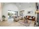 Living room featuring vaulted ceilings, a fireplace, and sliding glass doors to the patio at 187 Lone Pine Rd, Statesville, NC 28625