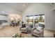 Bright living room with vaulted ceiling, hardwood floors, and sliding glass doors leading to backyard at 187 Lone Pine Rd, Statesville, NC 28625