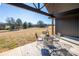 Covered patio with metal table and chairs, offering a view of the backyard at 187 Lone Pine Rd, Statesville, NC 28625