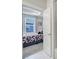 Bedroom doorway view into the en suite bathroom with marble tiled shower and neutral carpet at 2013 Federation Ct, Charlotte, NC 28205