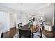 Open concept view of the dining area, showcasing hardwood floors and connecting to the kitchen area at 2013 Federation Ct, Charlotte, NC 28205