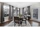 Dining area with a table, hardwood floors, natural light, and contemporary furnishings at 2013 Federation Ct, Charlotte, NC 28205