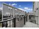 View of the rear of the townhome, showcasing a deck/balcony at 2013 Federation Ct, Charlotte, NC 28205