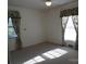 Bright bedroom with carpeted floors and floral curtains at 211 Walnut Ave, Mount Holly, NC 28120