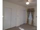 Bedroom with carpet, window, and double sliding doors at 211 Walnut Ave, Mount Holly, NC 28120