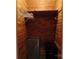 Cedar closet with shelving and a small safe at 211 Walnut Ave, Mount Holly, NC 28120