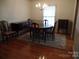 Dining room with hardwood floors and a chandelier at 211 Walnut Ave, Mount Holly, NC 28120