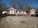 Brick ranch home with attached garage and spacious yard at 211 Walnut Ave, Mount Holly, NC 28120