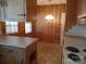 Kitchen with wood paneling, light countertops, and a built-in at 211 Walnut Ave, Mount Holly, NC 28120