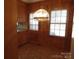 Kitchen with wood cabinets, tiled floor, and a chandelier at 211 Walnut Ave, Mount Holly, NC 28120