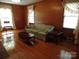 Living room with hardwood floors and wood paneling at 211 Walnut Ave, Mount Holly, NC 28120