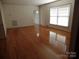 Spacious living room with hardwood floors and large windows at 211 Walnut Ave, Mount Holly, NC 28120