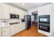 Spacious kitchen with white cabinets and stainless steel appliances at 2420 Valelake Rd, York, SC 29745