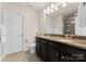 Double vanity bathroom with granite countertops and a shower at 2430 Kensington Station Pkwy, Charlotte, NC 28210