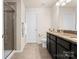 Double vanity bathroom with granite countertops and a shower at 2430 Kensington Station Pkwy, Charlotte, NC 28210