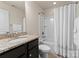 Clean bathroom with granite countertop and bathtub at 2430 Kensington Station Pkwy, Charlotte, NC 28210