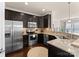 Stainless steel appliances and dark brown cabinets in kitchen at 2430 Kensington Station Pkwy, Charlotte, NC 28210